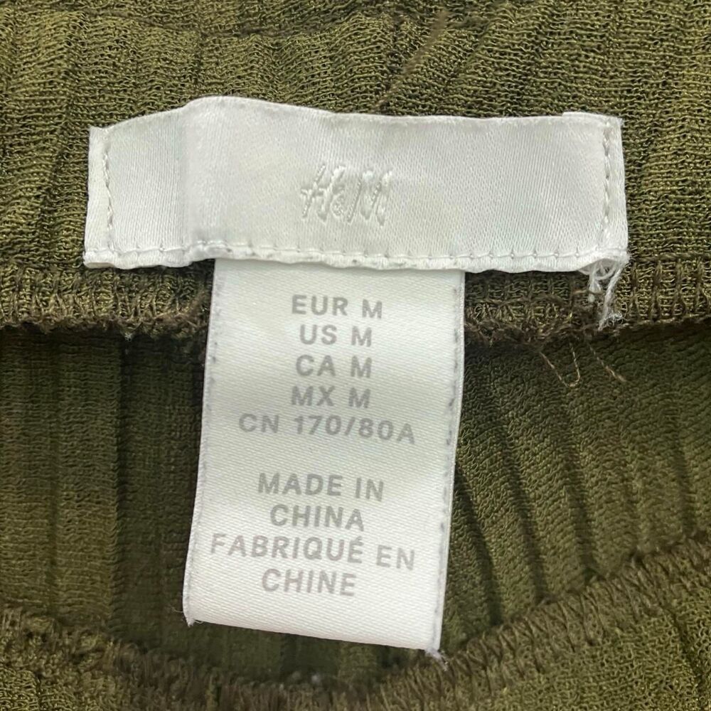 H&M women's olive green pleated flare lettuce hem pants | size medium - Picture 4 of 6